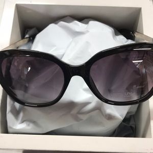 New sunglasses. Black frames.  Metal bows gold